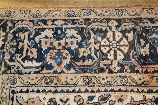 A Persian red ground carpet with pole medallion 372 x 255cm